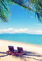 Beautiful beach. Chairs on the  sandy beach near the sea. Summer