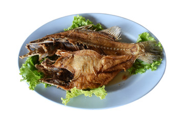 fried snapper fish With seafood sauce and vegetables.