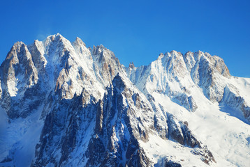 Fototapeta na wymiar Snowy peaks at the Mont Blanc area. Mont Blanc mountain massif summer landscape