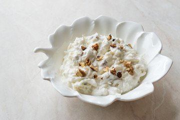 Celery Salad with Yogurt and Walnuts in Leaf Shaped Plate