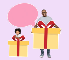Happy father and son holding gift boxes