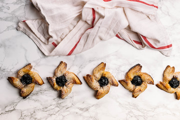 Scandinavian pastry Joulutorttu is traditional finnish and Swedish christmas pastry. It is traditionally made from puff pastry in the shape of a star or pinwheel and filled with prune jam and often du