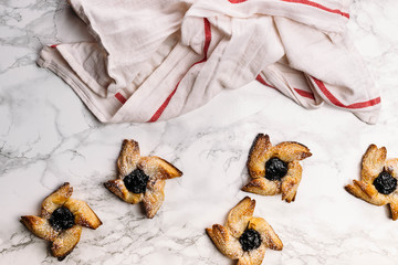 Scandinavian pastry Joulutorttu is traditional finnish and Swedish christmas pastry. It is traditionally made from puff pastry in the shape of a star or pinwheel and filled with prune jam and often du