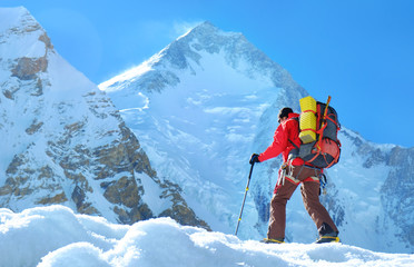 Climber reache the summit of mountain peak. Climber on the glacier. Success, freedom and happiness, achievement in mountains. Climbing sport concept.