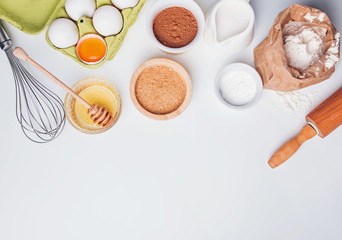 Tools and ingredients for baking: flour, eggs, sugar and other.