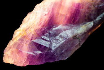 Natural untreated crystal amethyst on a black background