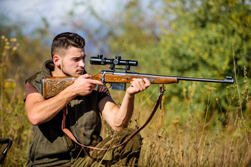 Hunting weapon gun or rifle. Hunting target. Looking at target through sniper scope. Man hunter...