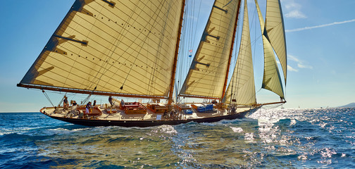 Sailboat under white sails at the regatta. Sailing yacht race - 233165446