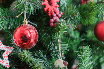 Red christmas ball on the christmas tree.