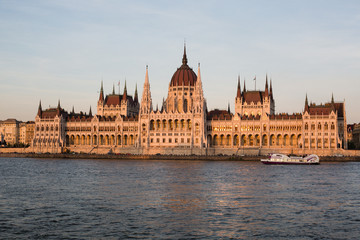 Fototapeta na wymiar Budapest parliament building at sunset golden time with blue and Danube river