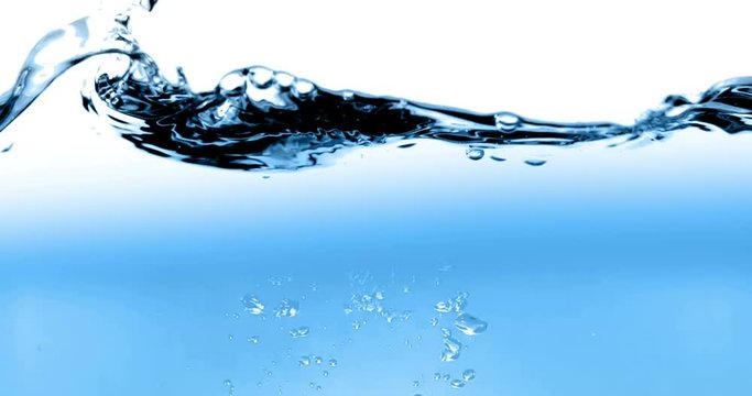 blue wave water with bubbles in tank on white background, slow motion movement, concept of clean and purity, healthcare and medical