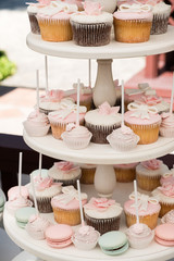 Candy bar. muffins, pastries and macaroni on stand