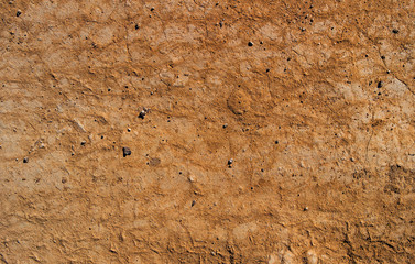 Dry soil texture and background. Brown soil background. Abstract ground. Natural abstraction. Cracked soil background. Clay. Ocher