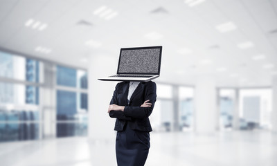 Business woman with laptop instead of head.