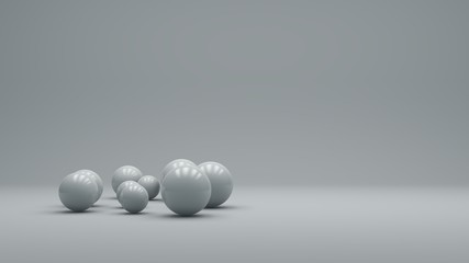 3d rendering of several sized reflected spheres inside a white studio. minimal design. modern motion graphics.