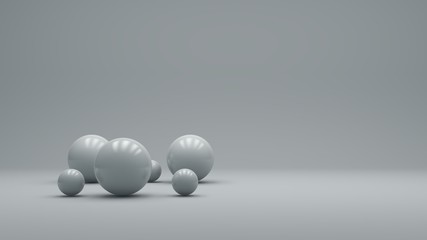 3d rendering of several sized reflected spheres inside a white studio. minimal design. modern motion graphics.
