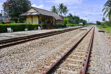 Fototapeta na wymiar small train station in southern thailand with track and blue sky