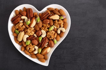 Nuts on a plate in the shape of a heart.