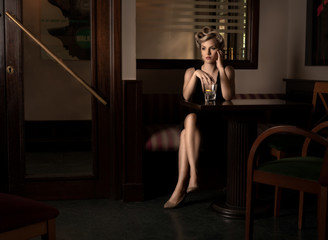 Obraz na płótnie Canvas Movie scene with a femme fatal waiting in a restaurant.