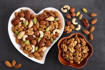 Fototapeta premium Nuts on a plate in the shape of a heart.