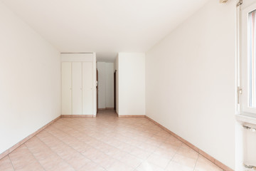 Front view of empty room with wardrobe