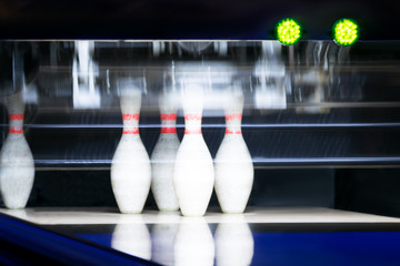 5 remaining bowling pins after the first throw, background night light