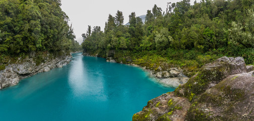 Naklejka na ściany i meble Blue water and rocks of the Hokitika Gorge Scenic Reserve, South Island New Zealand
