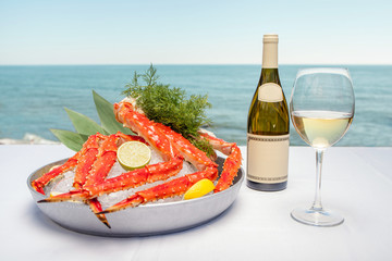 Crab dish on the background of the sea with wine