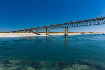 Fototapeta na wymiar New Zealand's longest one-lane bridge over Haast River, South Westland