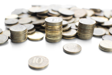 on a white background with a reflection of a lot of scattered coins and a column