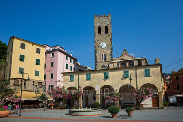 Fototapeta na wymiar View of a fountain and piazza in front of a church in Monterosso al Mare, Cinque Terre, Italy