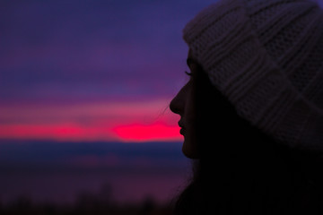 silhouette of woman at sunset