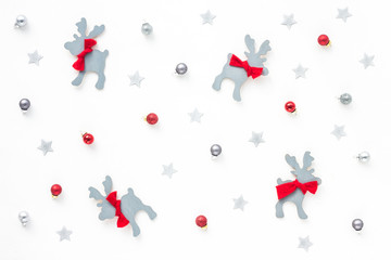 Christmas deer, red, silver, grey christmas decoration on white background, top view, flat lay