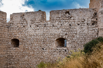 Ruins of an old castle on the mountain in Greece