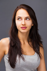 Naklejka premium Happy Beautiful brunette woman in dress