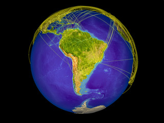 South America from space on Earth with lines representing international communication, travel, connections.