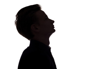 silhouette of thoughtful guy, man face profile on a white isolated background