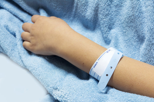 hand with patient identification bracelet