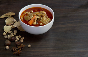 Chicken massaman curry with herb on wooden background, coconut milk curry, Thai local food