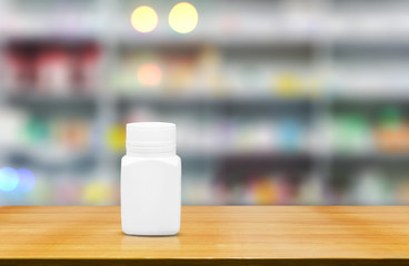 Blank white medicine bottle on counter