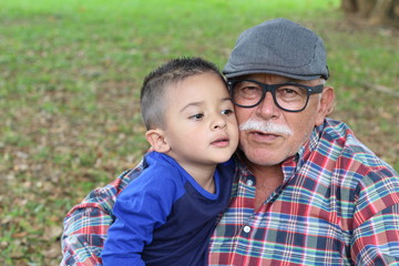 Fototapeta na wymiar Tender image of grandparent with grandson