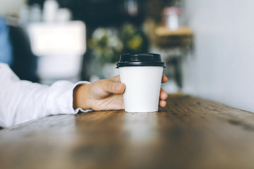 hand with cup of coffee