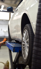  Car technician repairing car in workshop service station