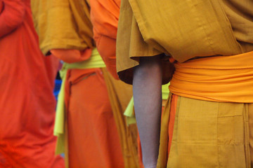 Monks recept alms in the streets of Luang Prabang, Laos