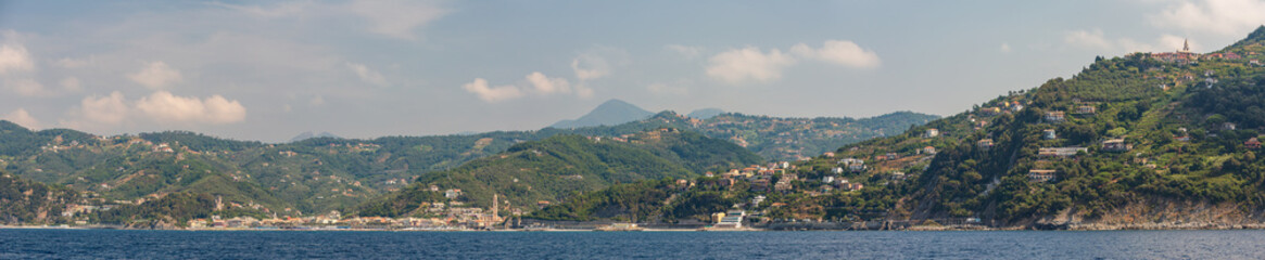 Fototapeta na wymiar Panoramic view of the seaside town of Moneglia on the Ligurian coast in Italy, as seen from the sea