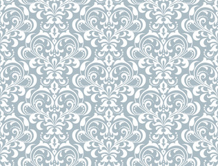 Floral pattern. Vintage wallpaper in the Baroque style. Seamless vector background. White and blue ornament for fabric, wallpaper, packaging. Ornate Damask flower ornament