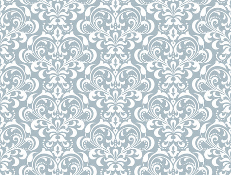 Floral pattern. Vintage wallpaper in the Baroque style. Seamless vector background. White and blue ornament for fabric, wallpaper, packaging. Ornate Damask flower ornament