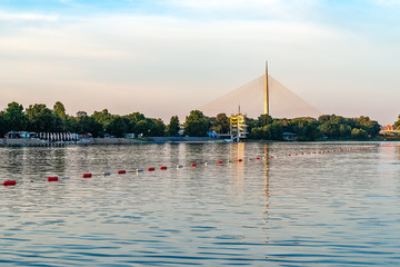 Naklejka premium Belgrade, Serbia - 20 June, 2018: Side view of Ada bridge over Ada Ciganlija lake