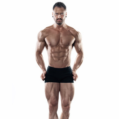 Fototapeta na wymiar Brutal strong bodybuilder athletic man posing on white background.