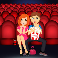 Naklejka premium couple is watching a horror movie in a cinema